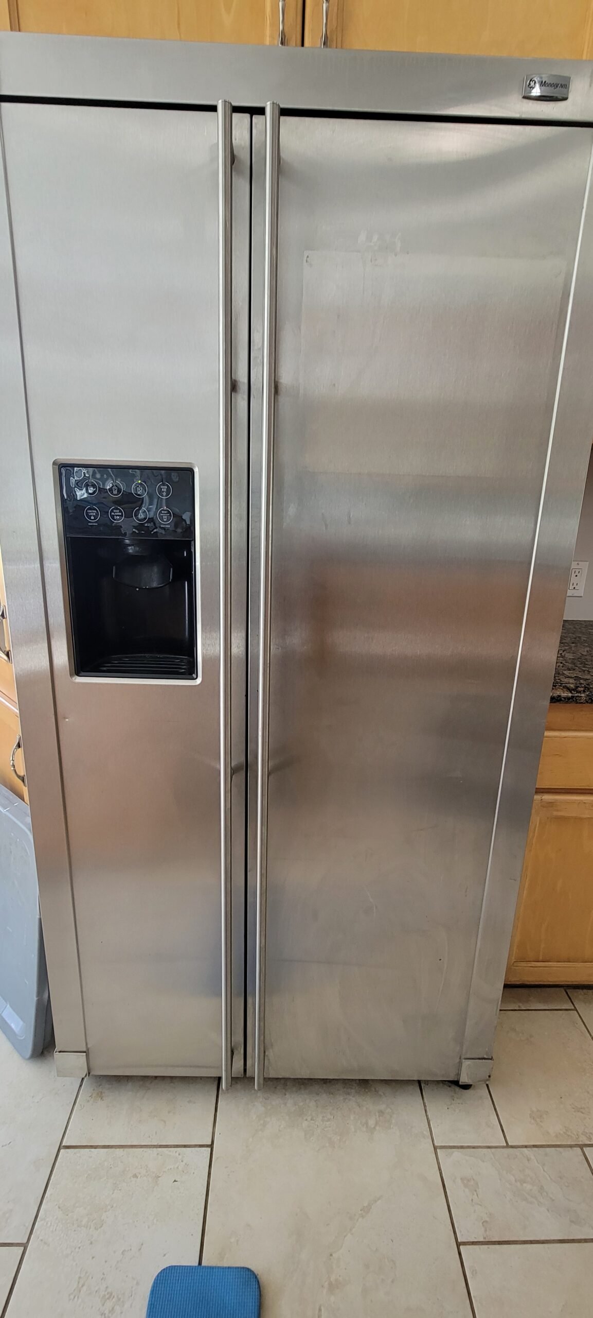 Clean kitchen with stainless steel refrigerator