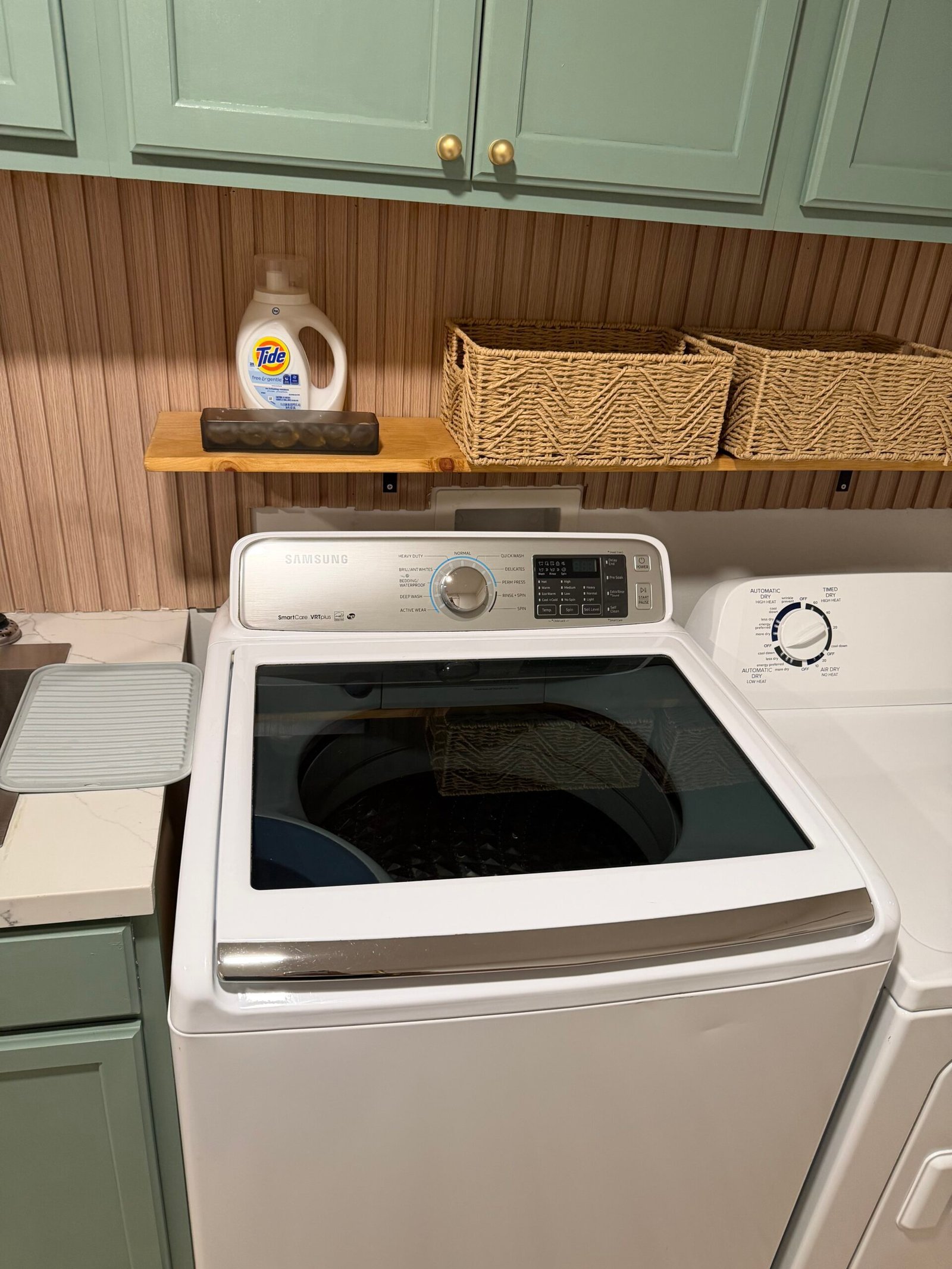 Clean laundry room washer and dryer for apartment residents