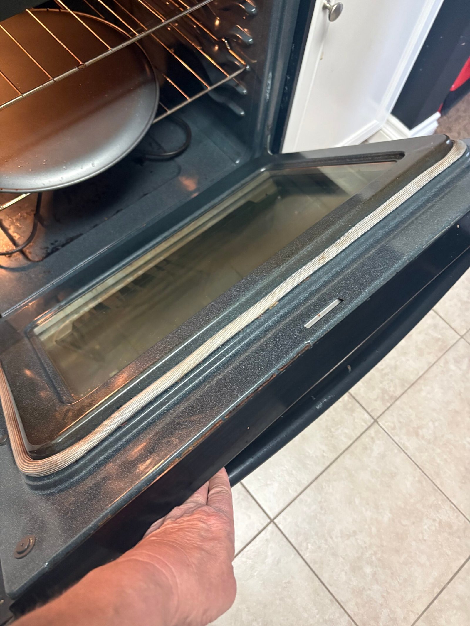 Deep cleaning tackles built-up grime around an oven door seal