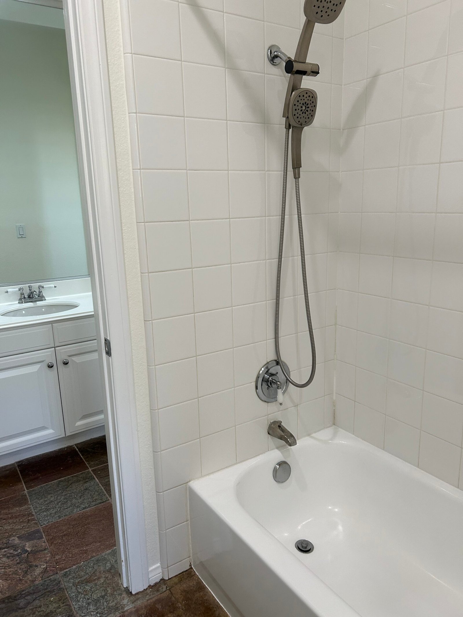 Clean glass shower head close-up, spot-free