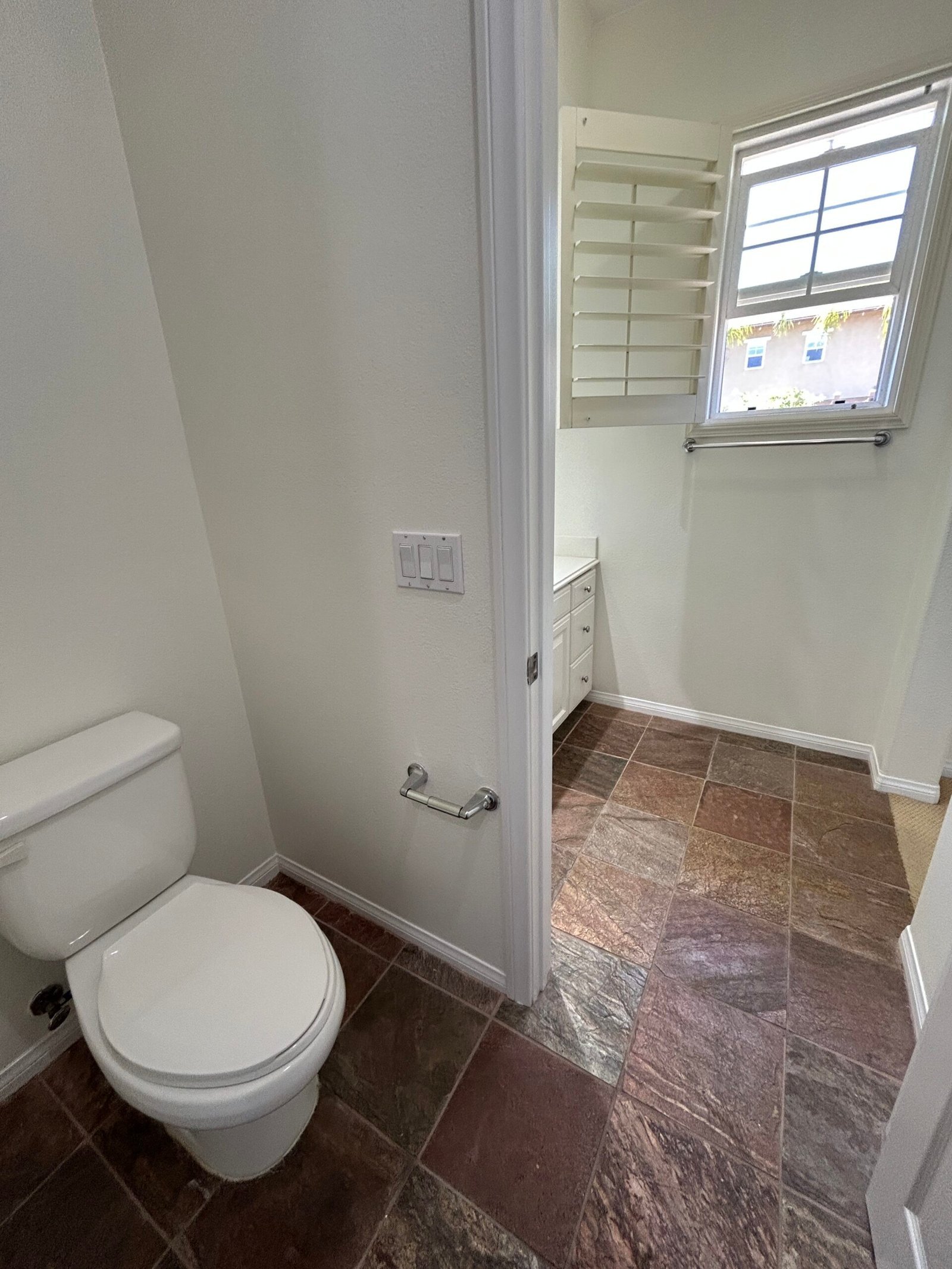Clean bathroom with spotless toilet and fixtures