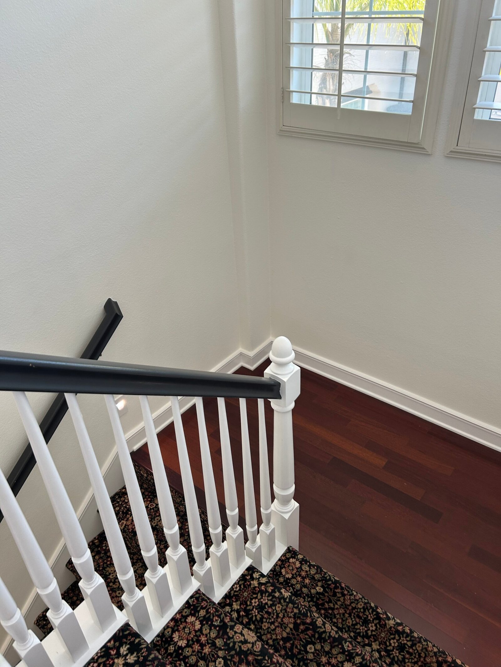 Clean staircase railing in a tidy home for busy professionals
