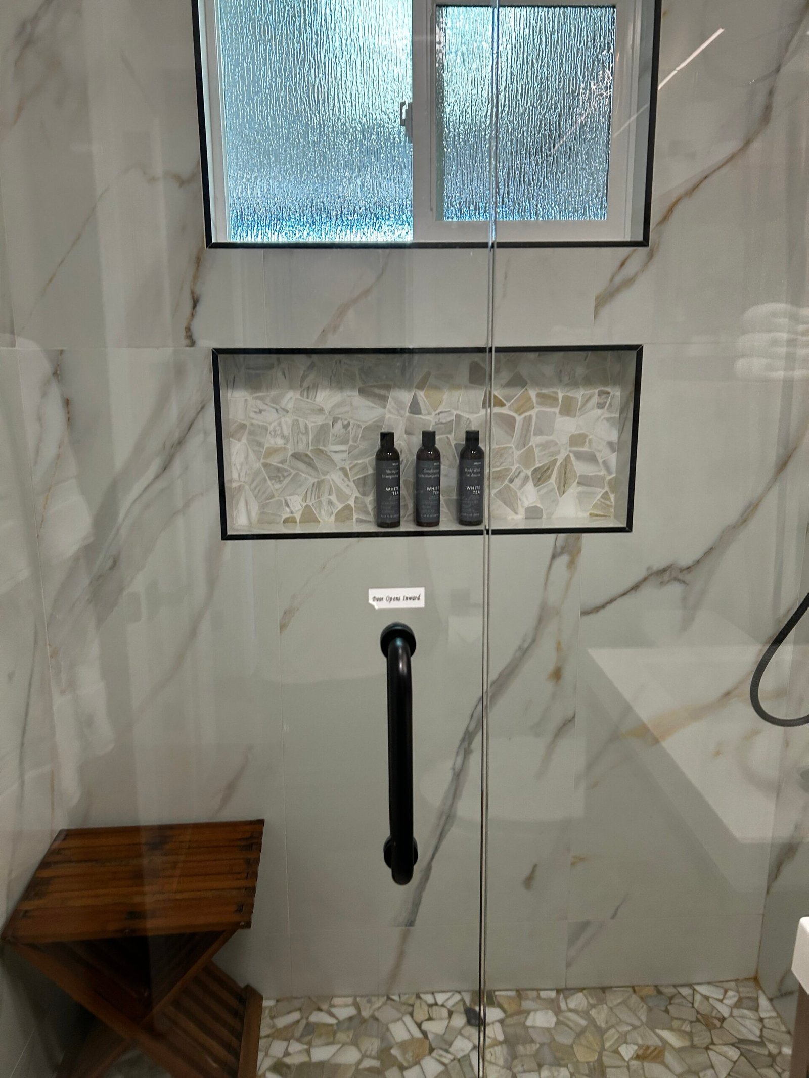 Clean marble bathroom and shower area