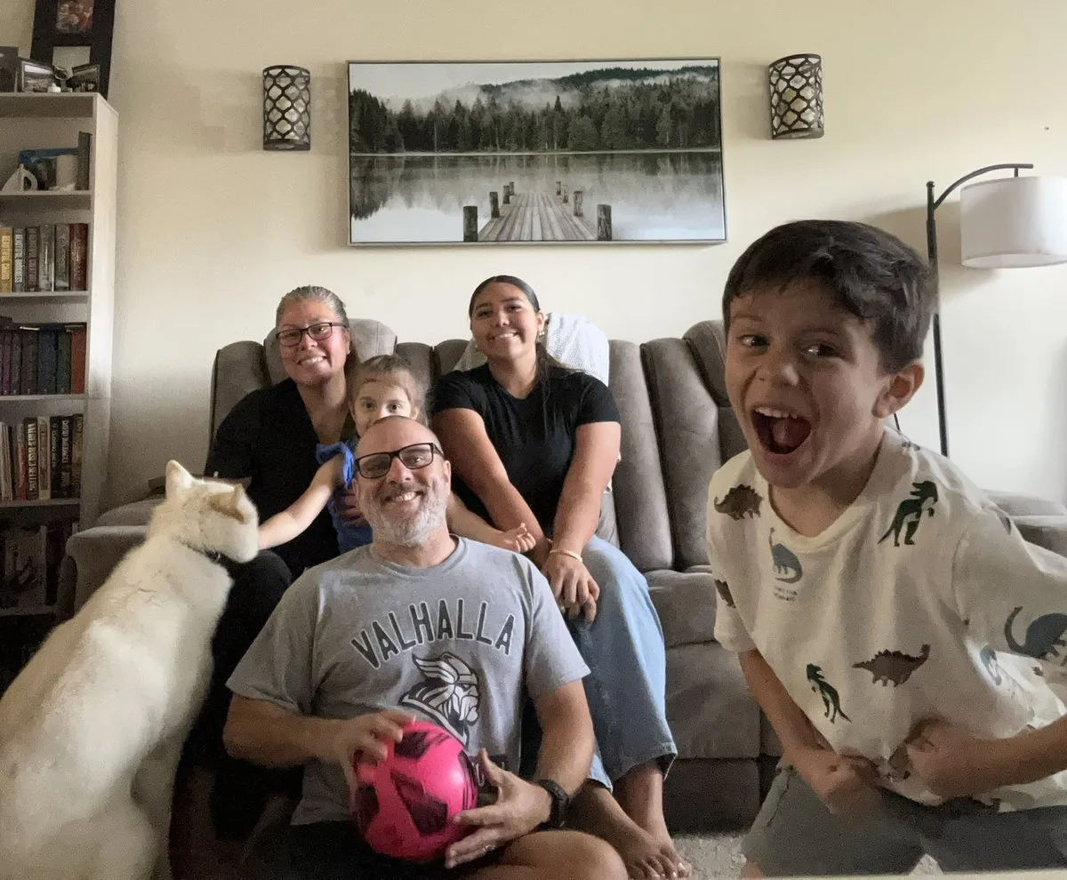 Paul, Lina, and their children at home with their cat during Suddenly Clean's first year