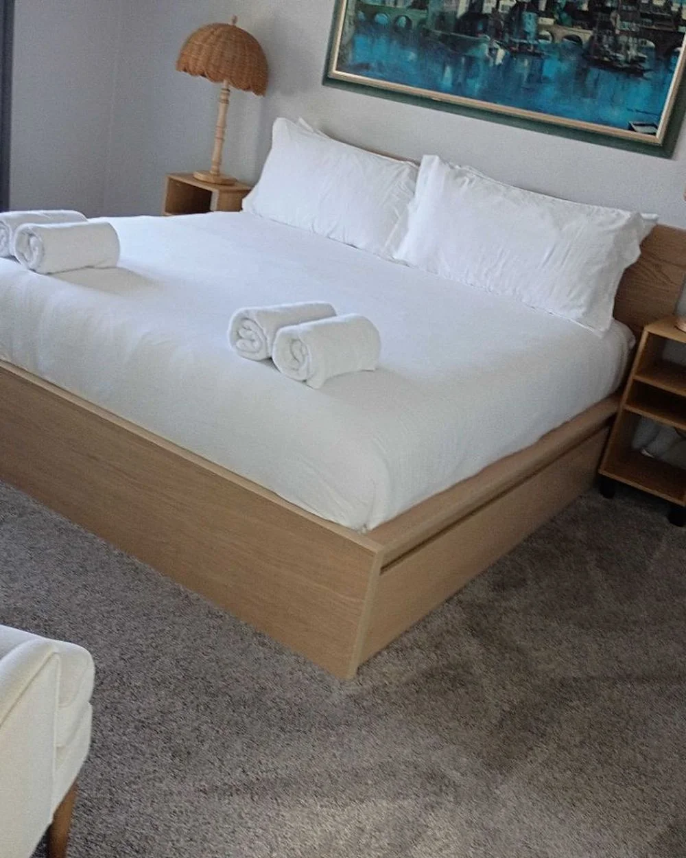 Neatly made Airbnb bedroom after a vacation rental turnover cleaning