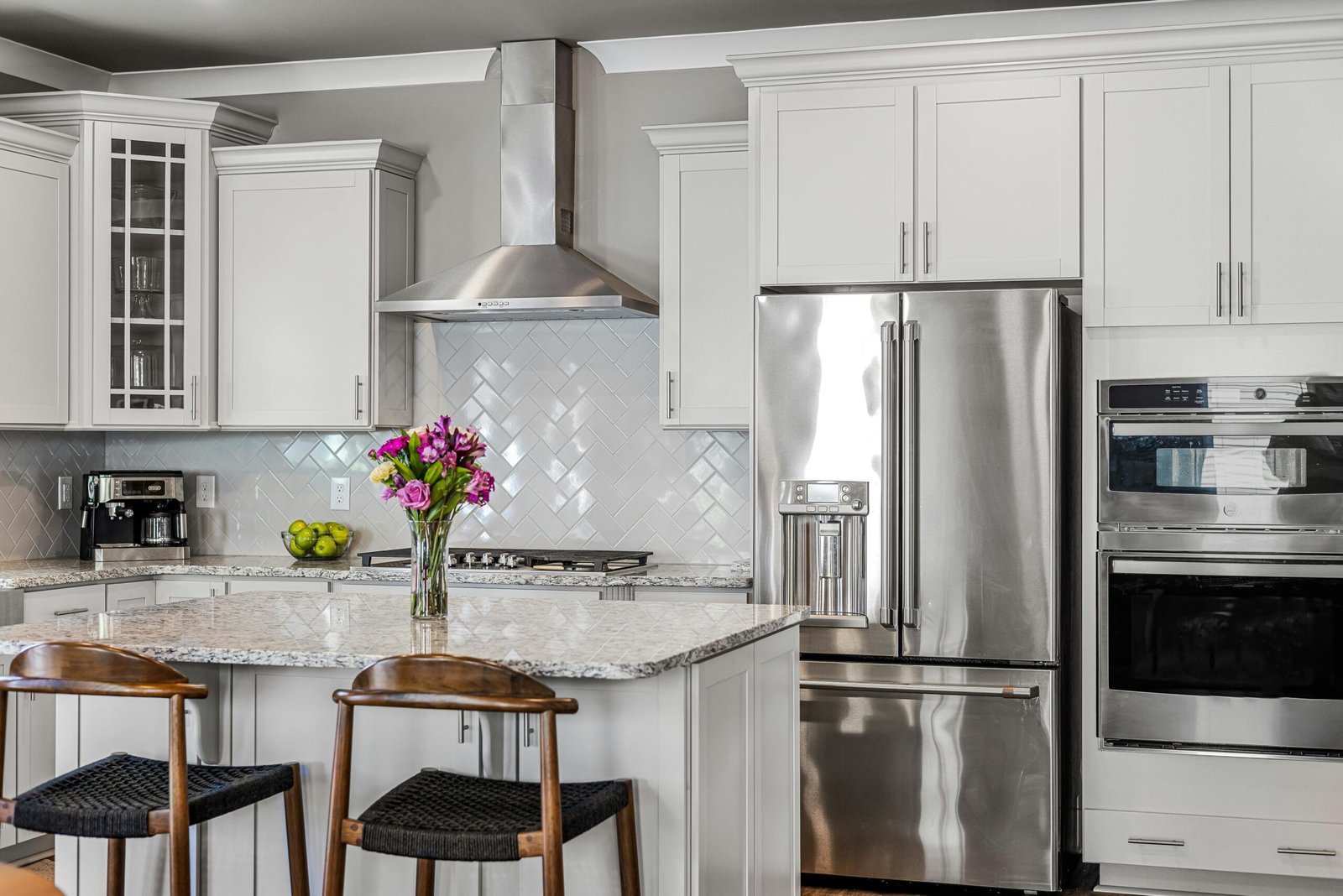 Bright, freshly organized kitchen with island in a Suddenly Clean service area home