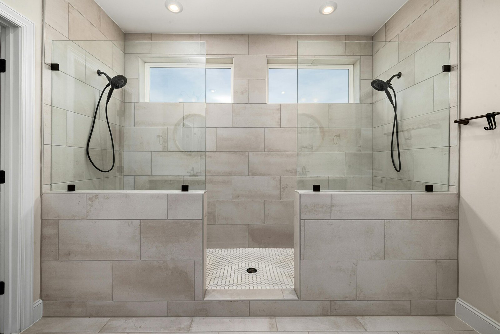 Sparkling clean walk-in shower and bathroom tile after a professional cleaning