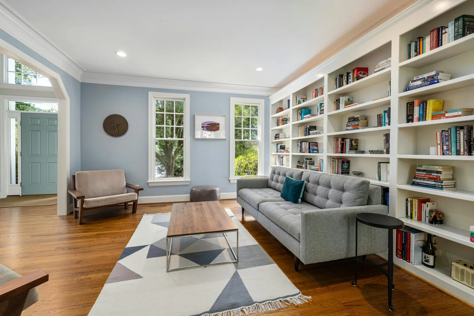 Tidy, freshly cleaned living room with built-in shelving in a local home