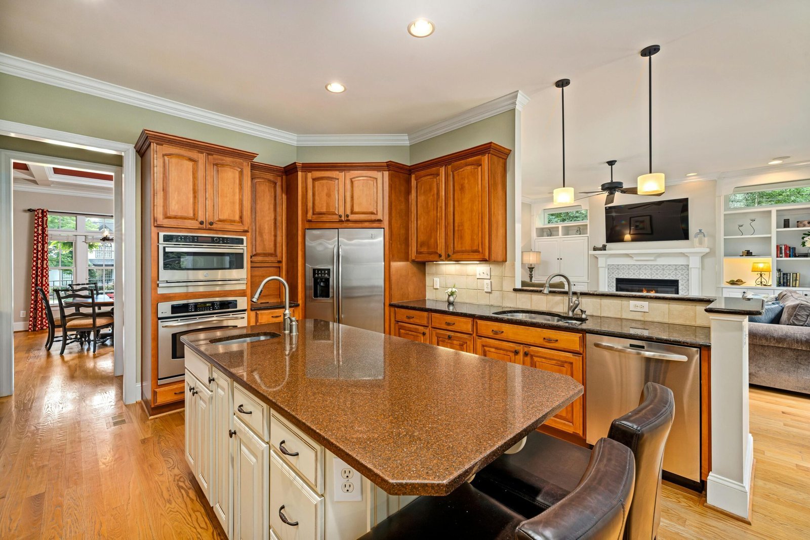 Freshly cleaned kitchen with granite counters and stainless appliances