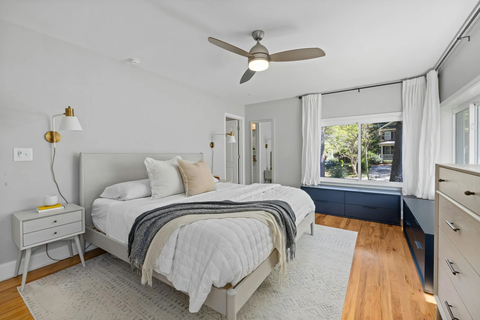 Freshly made bed with clean linens in a tidy bedroom