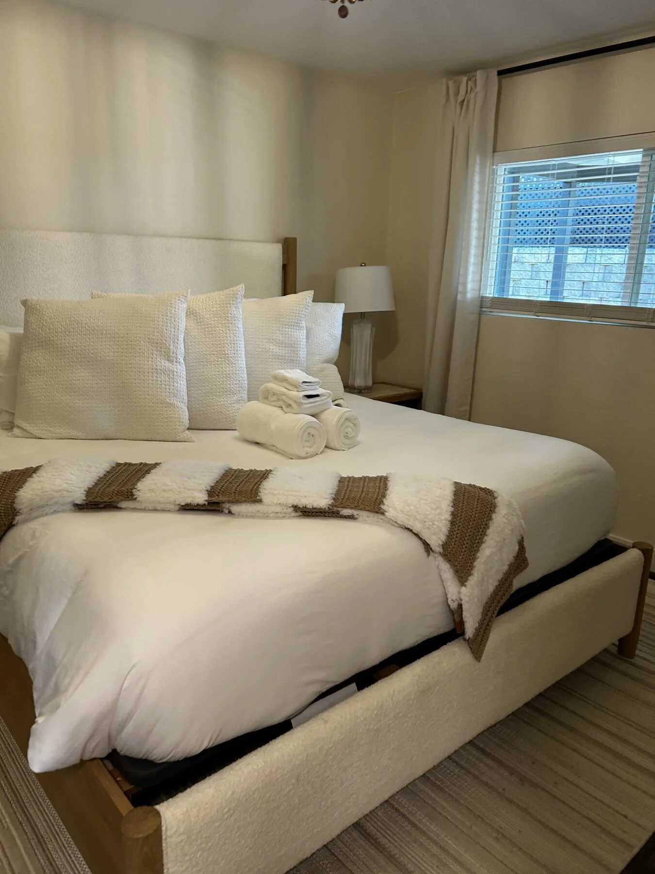 Bed made with fresh linens changed during a Suddenly Clean recurring visit